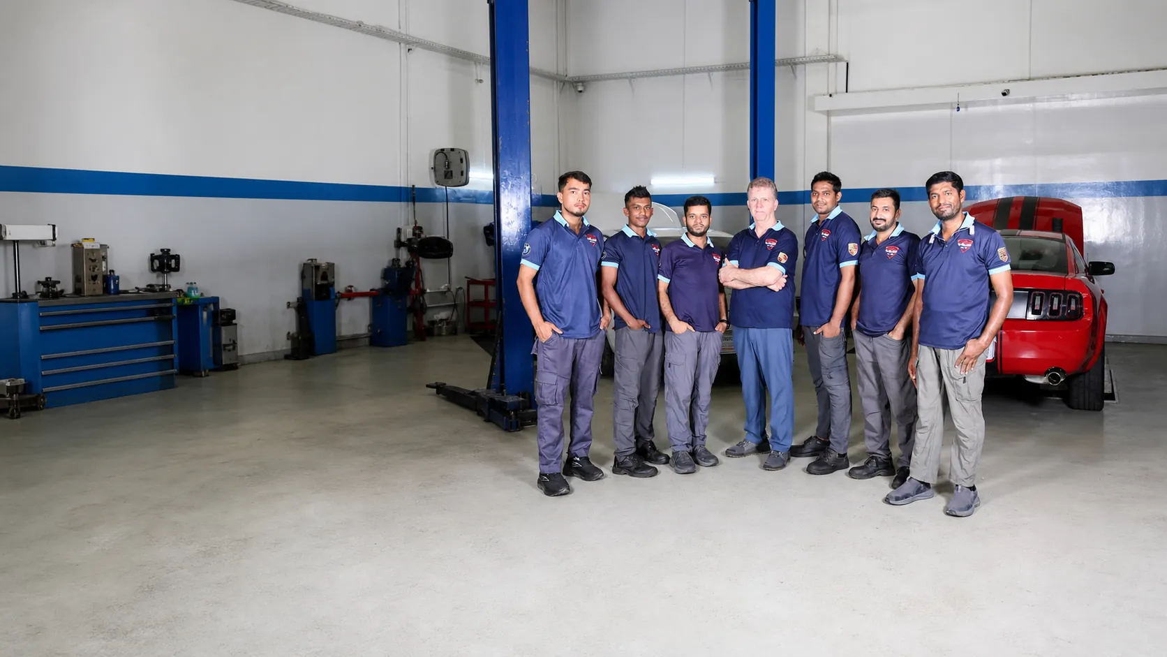 Missak Auto Garage technicians standing in the Mussafah workshop