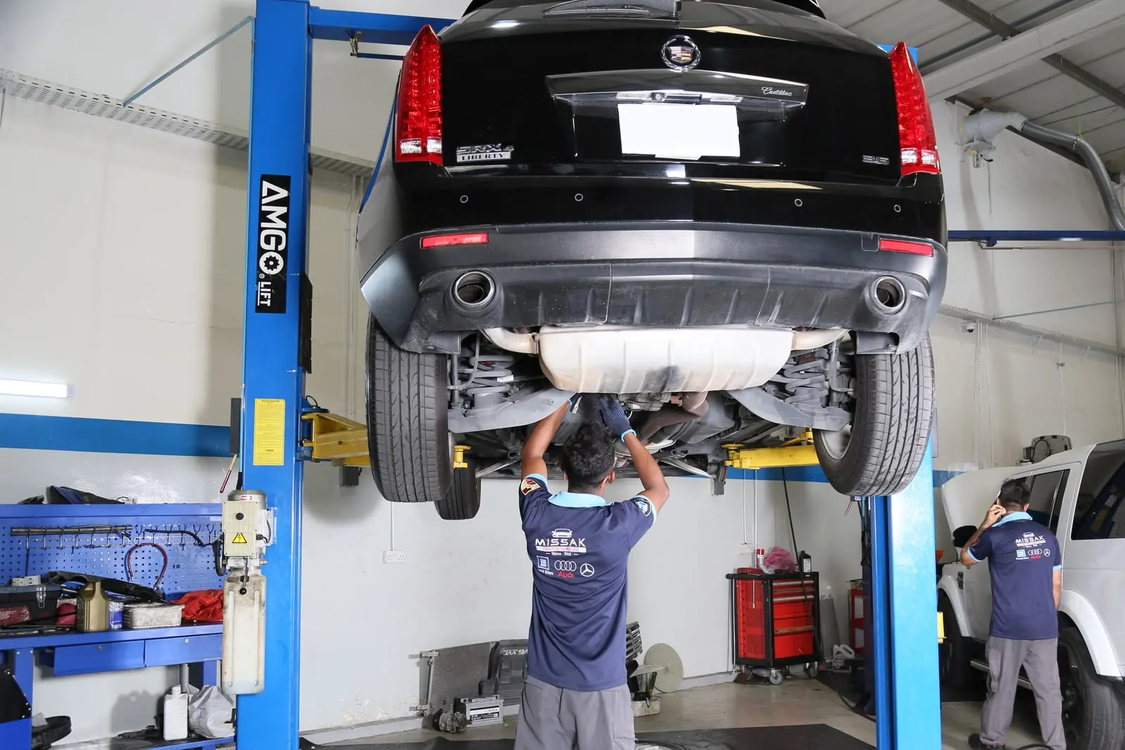 Vehicle raised for an under-chassis inspection at Missak Auto Garage